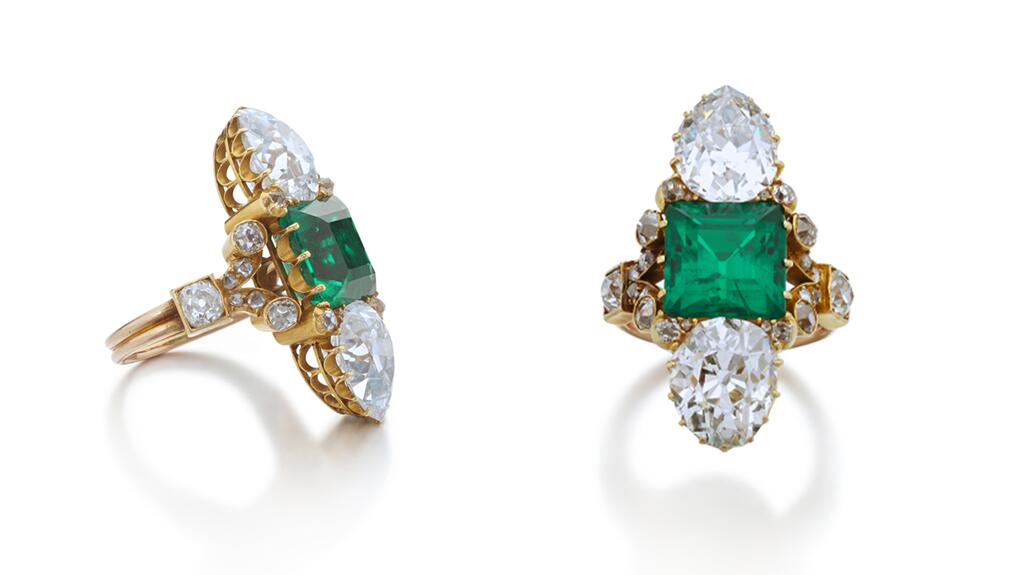 A ring set with a step-cut emerald flanked by pear-shaped diamonds, with shoulders accented by old cushion-shaped, circular-cut and rose diamonds emerald and diamond ring